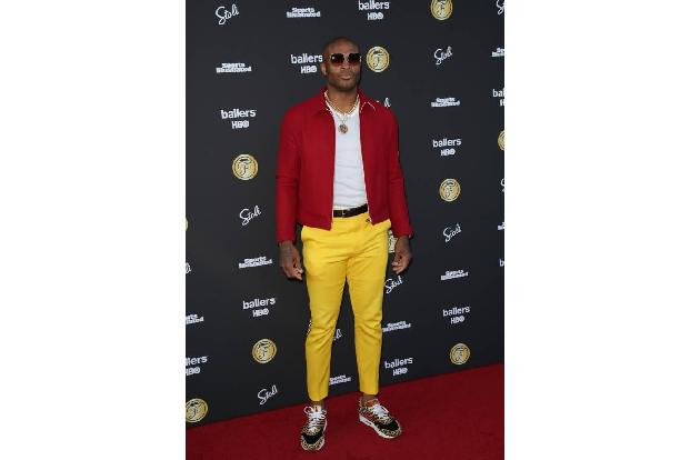 ...Houston-Rockets-Star P. J. Tucker und kombinierte zu seiner gelben Hose eine rote Jacke. Kein Wunder, dass 'Sports Illust...
