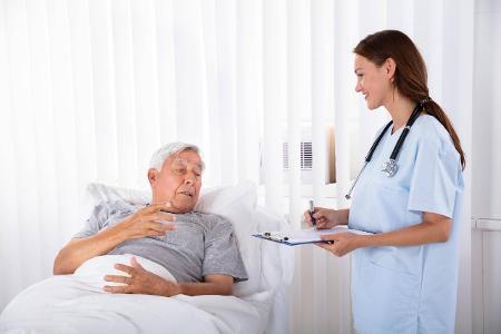 Nurse With Clipboard Visiting Senior Patient ,model released...