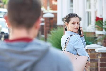 Young Woman Calling For Help On Mobile Phone Whilst Being St...