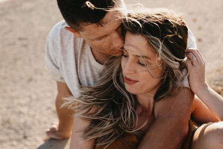 Affectionate young couple on the beach model released Symbol...