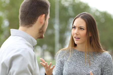 Couple talking seriously outdoors ,model released, Symbolfot...