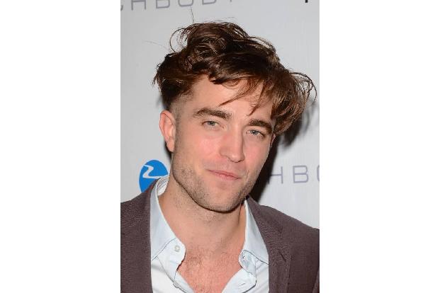 ...Robert Pattinson, der als Zuschauer in der ersten Reihe saß. Wollte KStew mit ihrem Busenblitzer womöglich Robert Pattins...