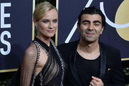 Das Prada-Kleid von Diane Kruger setzte mit Glitzer-Applikationen Akzente und bestach zudem durch ein Cape. Sie posierte neb...