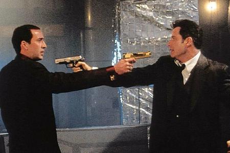 Nicolas Cage (l.) und John Travolta in 