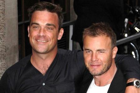 Robbie Williams (l.) und Gary Barlow kamen in der Corona-Krise mehr als einmal virtuell zusammen.