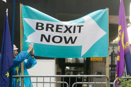 October 15, 2019, London, United Kingdom A woman stands nex...