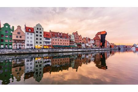 Gdansk skyline at sunset seen at the waterfront of Motlawa river, Gdansk, Poland