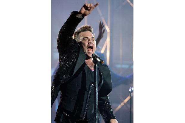 'Life Thru A Lens' war der Beginn einer erfolgreichen Zusammenarbeit mit dem Songwriter und Produzenten Guy Chambers, der für die nächsten Jahre maßgeblich zum Erfolg von Robbie Williams beitrug. Das ...