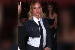 Diane Kruger mit Krawatte und Jeans-Kombi auf dem roten Teppich