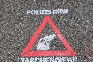 Sprühschablone Kriminalprävention gegen Taschendiebe