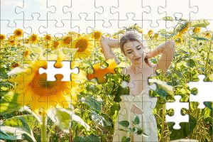 Puzzle: Frau im Sonnenblumenfeld