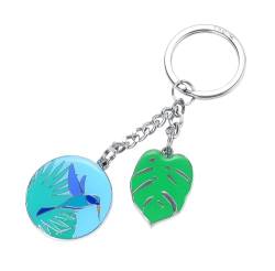 TROIKA Schlüsselanhänger Kolibri und Monstera Blatt – KOLIBRI – tropischer keyring, hochwertiger Metallguss, echte Emaille – inkl. Schlüsselring – verchromt – blau, grün, türkis Original von TROIKA